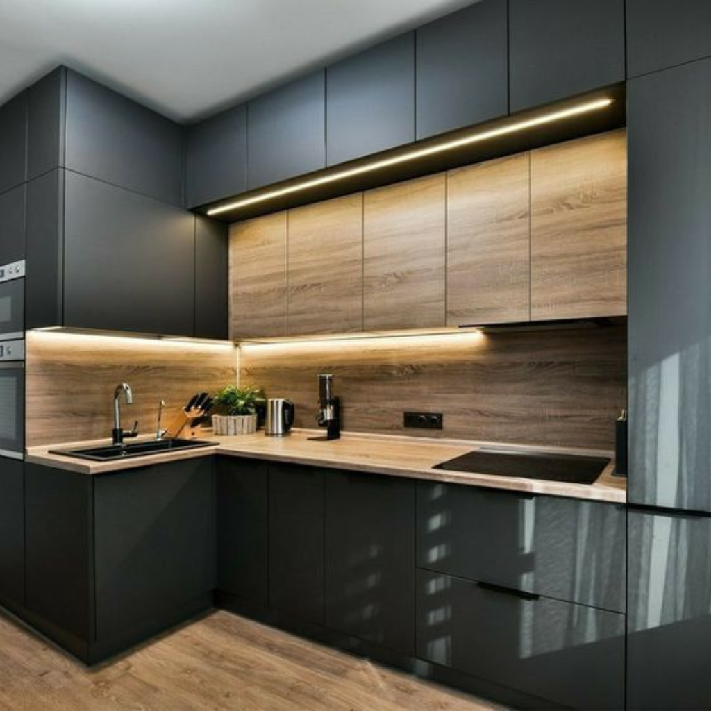 Modern dark-kitchen with matte black lower cabinets, wood grain backsplash and countertops, and under-cabinet lighting.