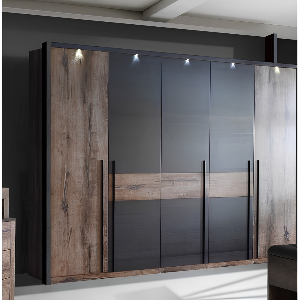 Large modern wardrobe with wood-textured panels and dark gray doors, featuring tall vertical handles in a showroom-like setting.